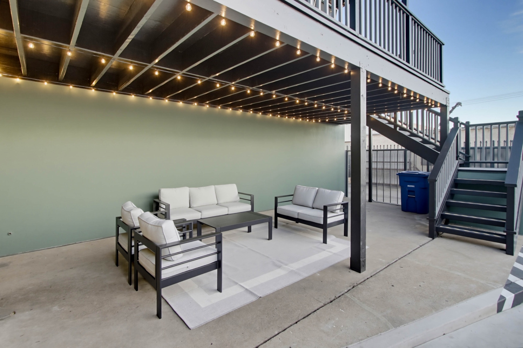 Outdoor lounge seating below the mezzanine
