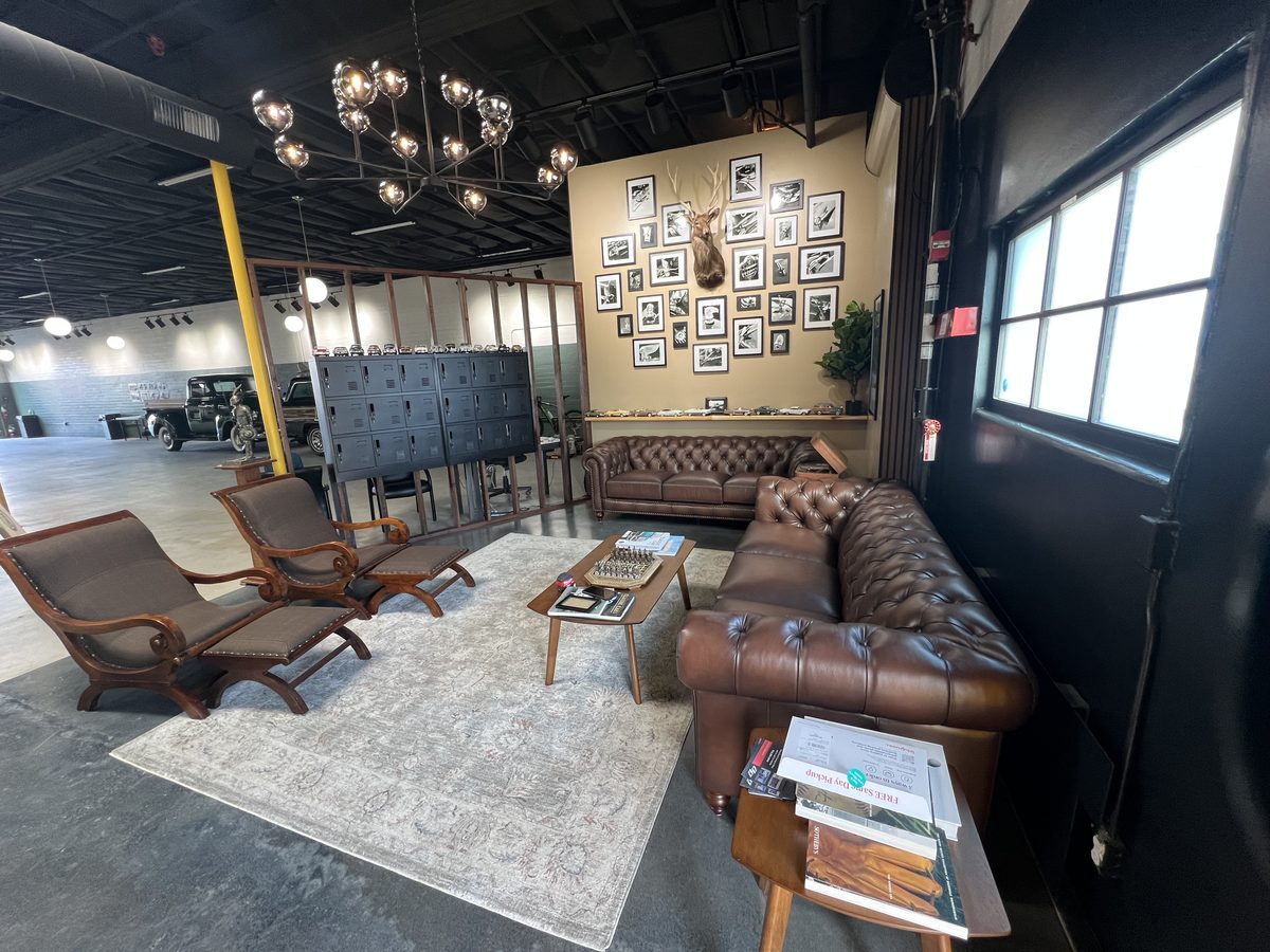 The Lounge — wider angle with photo wall and seating
