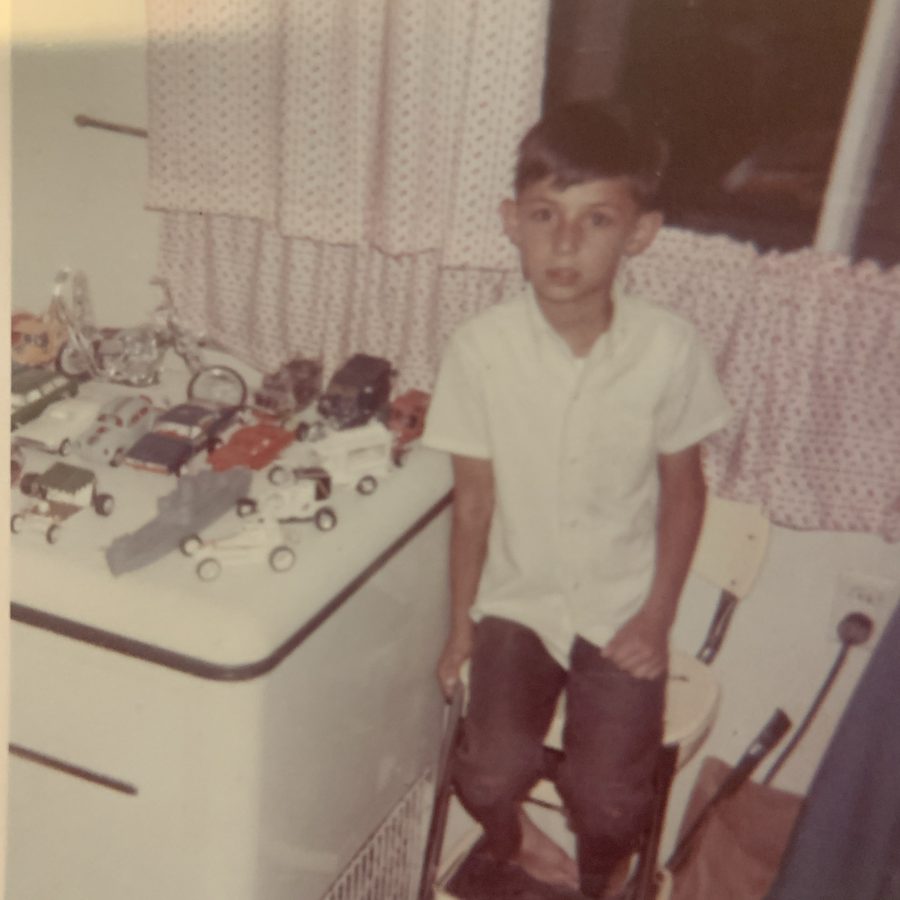 Young Michael with his toy car collection