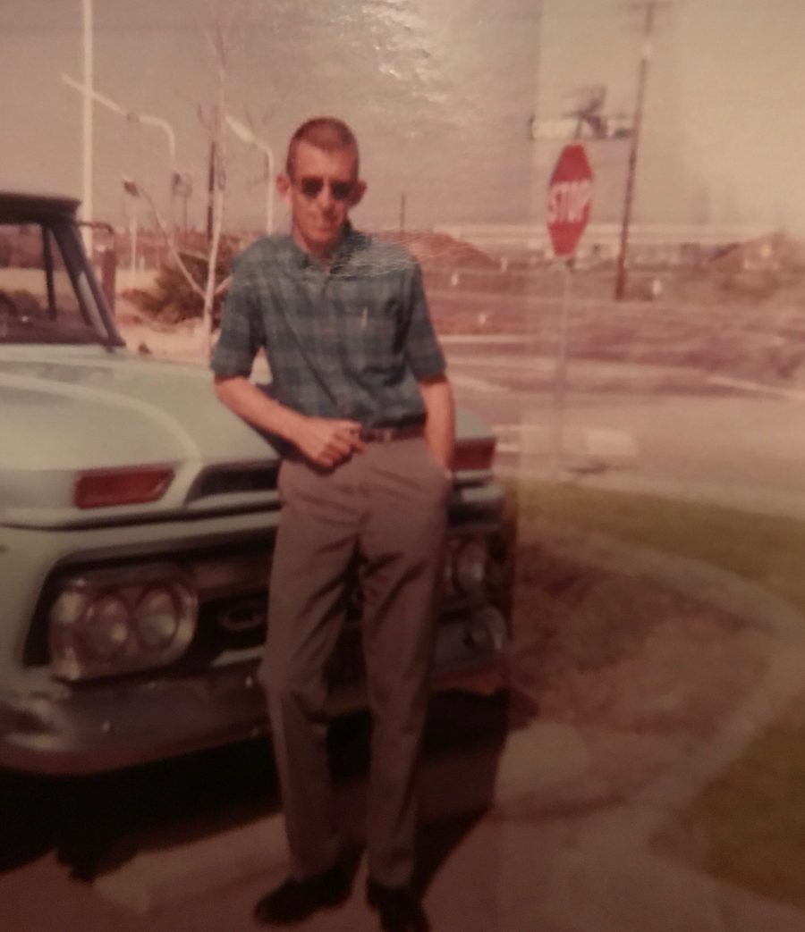 Young Gillie leaning against his truck