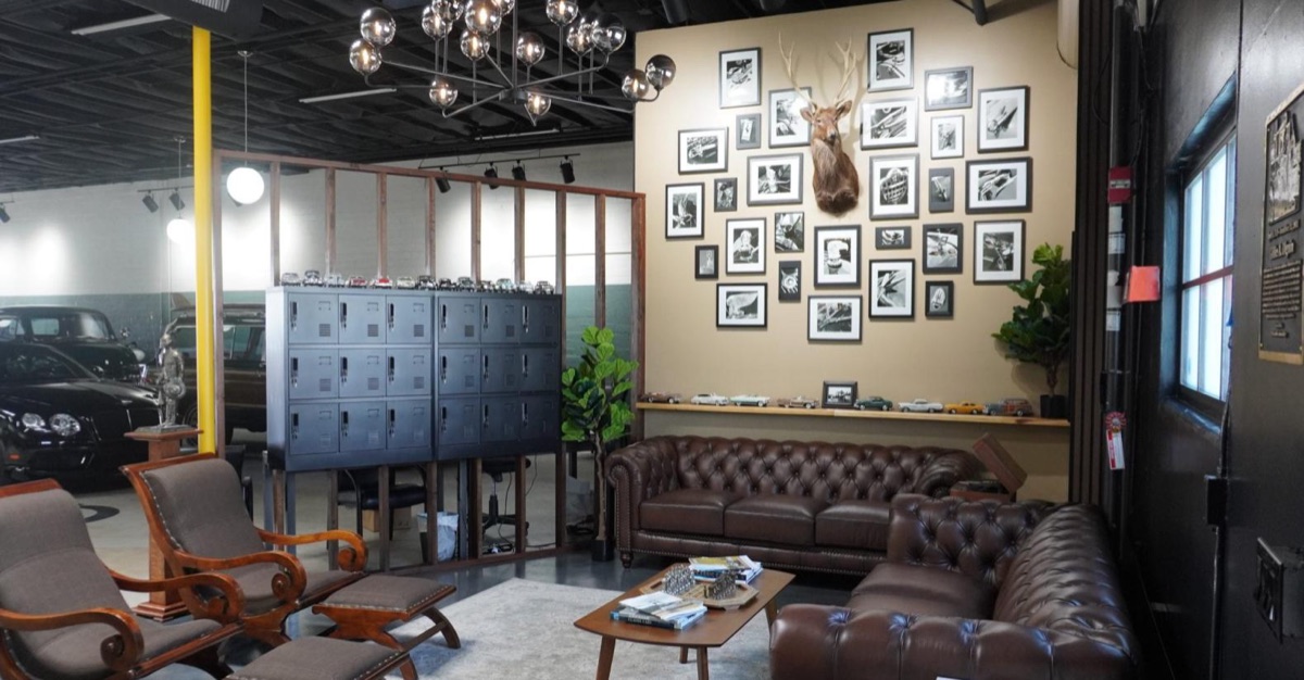 The lounge at Gillie's Auto Lounge with leather couches, liquor lockers and a wall of black-and-white photographs